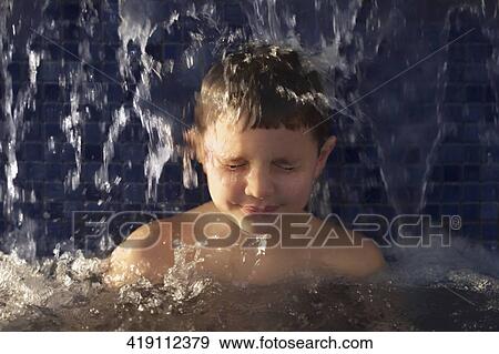 Close-up of a boy in a swimming pool View Large Photo Image Stock Photo - Close-up of a boy in a swimming pool. Fotosearch