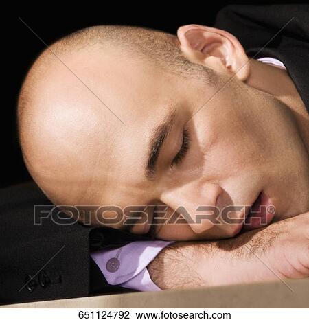 Close-up of a businessman in a bar View Large Photo Image Stock Image - Close-up of a businessman in a bar. Fotosearch