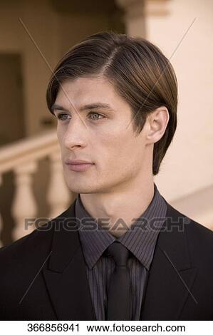 Stock Image - Close-up of a businessman thinking, Biltmore Hotel, Coral Gables, Florida, USA. Fotosearch