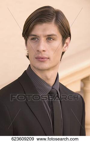 Stock Photo - Close-up of a businessman thinking, Biltmore Hotel, Coral Gables, Florida, USA. Fotosearch