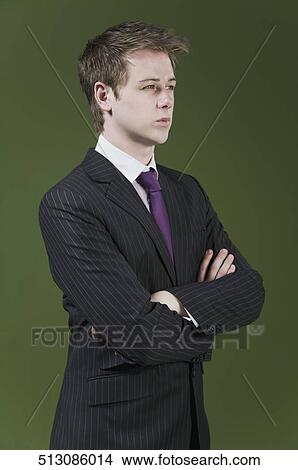 Close-up of a businessman with his arms crossed View Large Photo Image Picture - Close-up of a businessman with his arms crossed. Fotosearch