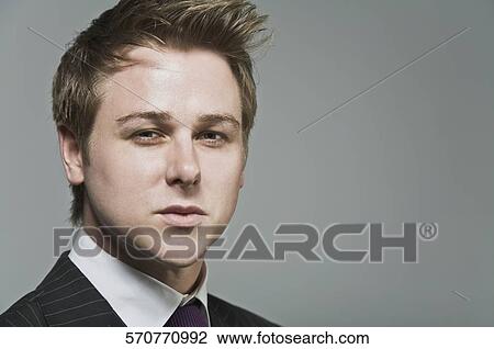 Close-up of a businessman's face View Large Photo Image Stock Image - Close-up of a businessman's face. Fotosearch