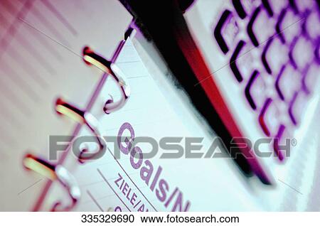 Close-up of a calculator with a spiral notebook View Large Photo Image Stock Image - Close-up of a calculator with a spiral notebook. Fotosearch