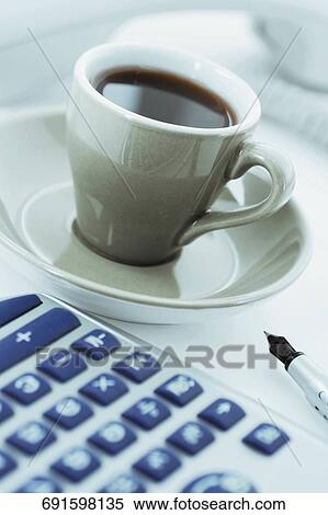Close-up of a calculator with black tea View Large Photo Image Stock Photography - Close-up of a calculator with black tea. Fotosearch