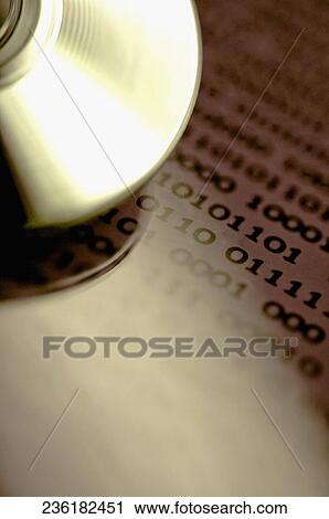 Close-up of a compact disc on a document View Large Photo Image Stock Image - Close-up of a compact disc on a document. Fotosearch