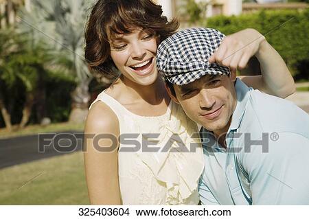 Picture - Close-up of a couple having fun in a hotel lawn, Biltmore Hotel, Coral Gables, Florida, USA. Fotosearch