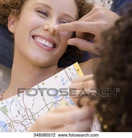Stock Image - Close-up of a couple having fun, Biltmore Hotel, Coral Gables, Florida, USA. Fotosearch