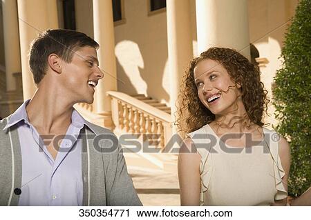 Stock Image - Close-up of a couple smiling, Biltmore Hotel, Coral Gables, Florida, USA. Fotosearch