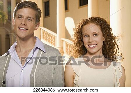 Stock Photography - Close-up of a couple smiling, Biltmore Hotel, Coral Gables, Florida, USA. Fotosearch