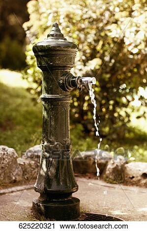 Close-up of a drinking fountain in a park, Madrid, Spain View Large Photo Image Stock Image - Close-up of a drinking fountain in a park, Madrid, Spain. Fotosearch