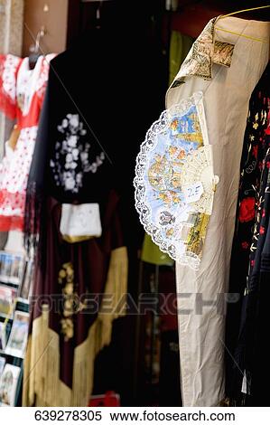 Close-up of a folding fan hanging on a clothing store, Madrid, Spain View Large Photo Image Stock Photography - Close-up of a folding fan hanging on a clothing store, Madrid, Spain. Fotosearch