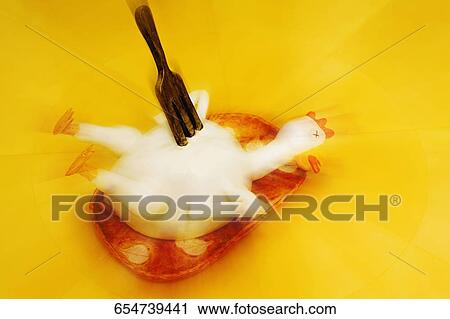 Close-up of a fork on a figurine of chicken View Large Photo Image Stock Image - Close-up of a fork on a figurine of chicken. Fotosearch