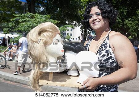 Close-up of a gay man holding a mannequin's heads, DuPont Circle, Washington DC, USA View Large Photo Image Stock Photography - Close-up of a gay man holding a mannequin's heads, DuPont Circle, Washington DC, USA. Fotosearch