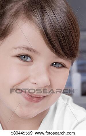 Close-up of a girl smiling View Large Photo Image Stock Photo - Close-up of a girl smiling. Fotosearch