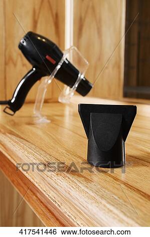 Close-up of a hair dryer on a stand View Large Photo Image Stock Photograph - Close-up of a hair dryer on a stand. Fotosearch