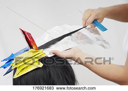 Close-up of a hairdresser's hands coloring a person's hair View Large Photo Image Stock Image - Close-up of a hairdresser's hands coloring a person's hair. Fotosearch