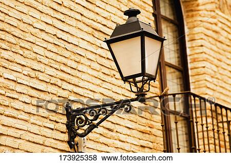 Stock Photo - Close-up of a lantern on a wall. Fotosearch