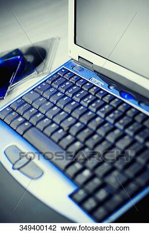 Close-up of a laptop with two cds View Large Photo Image Stock Image - Close-up of a laptop with two cds. Fotosearch