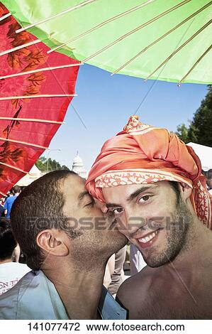 Stock Image - Close-up of a male homosexual couple, DuPont Circle, Washington DC, USA. Fotosearch