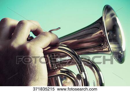 Close-up of a man blowing a bugle View Large Photo Image Stock Photography - Close-up of a man blowing a bugle. Fotosearch