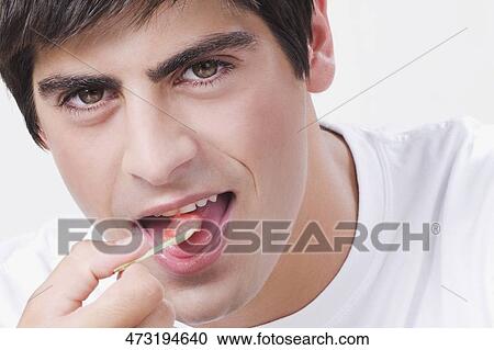 Close-up of a man eating an ice cream View Large Photo Image Stock Image - Close-up of a man eating an ice cream. Fotosearch
