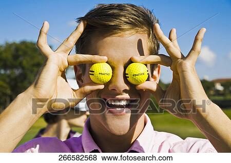 Close-up of a man holding golf balls in front of his eyes, Biltmore Golf Course, Coral Gables, Florida, USA View Large Photo Image Stock Photo - Close-up of a man holding golf balls in front of his eyes, Biltmore Golf Course, Coral Gables, Florida, USA. Fotosearch