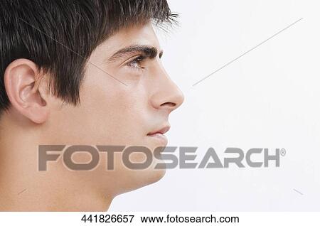 Close-up of a man looking serious View Large Photo Image Stock Photo - Close-up of a man looking serious. Fotosearch