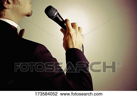 Close-up of a man singing View Large Photo Image Stock Image - Close-up of a man singing. Fotosearch