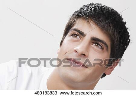 Stock Image - Close-up of a man smiling. Fotosearch