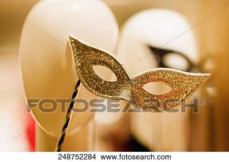 Picture - Close-up of a mannequin wearing a masquerade mask. Fotosearch