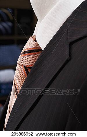 Close-up of a mannequin with formal suit in a clothing store View Large Photo Image Stock Image - Close-up of a mannequin with formal suit in a clothing store. Fotosearch
