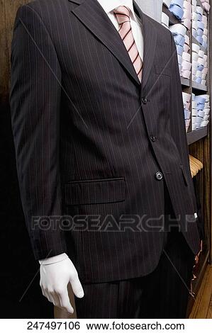 Close-up of a mannequin with formal suit in a clothing store View Large Photo Image Stock Photograph - Close-up of a mannequin with formal suit in a clothing store. Fotosearch