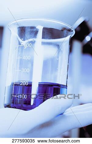 Close-up of a measuring beaker on a person's palm View Large Photo Image Stock Photography - Close-up of a measuring beaker on a person's palm. Fotosearch