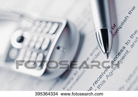 Close-up of a mobile phone with a pen on a sheet of paper View Large Photo Image Picture - Close-up of a mobile phone with a pen on a sheet of paper. Fotosearch