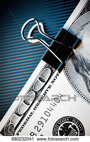 Close-up of a one hundred dollar bill in a paper clip View Large Photo Image Stock Image - Close-up of a one hundred dollar bill in a paper clip. Fotosearch