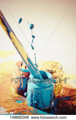 Close-up of a paintbrush in a paint bottle View Large Photo Image Stock Photograph - Close-up of a paintbrush in a paint bottle. Fotosearch