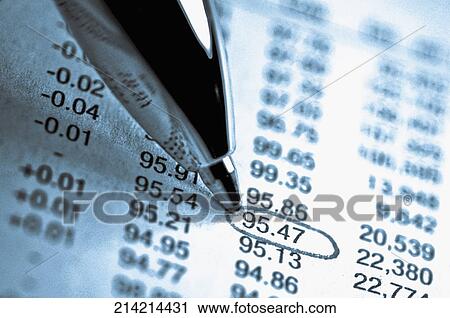 Stock Image - Close-up of a pen marking on a financial data. Fotosearch
