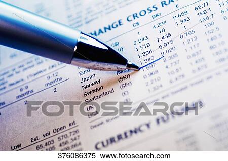 Close-up of a pen marking on a financial newspaper View Large Photo Image Stock Photography - Close-up of a pen marking on a financial newspaper. Fotosearch