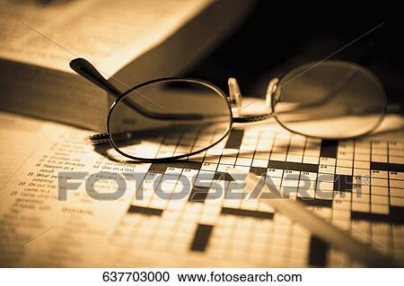 Close-up of a pencil and eyeglasses on a crossword puzzle View Large Photo Image Stock Image - Close-up of a pencil and eyeglasses on a crossword puzzle. Fotosearch