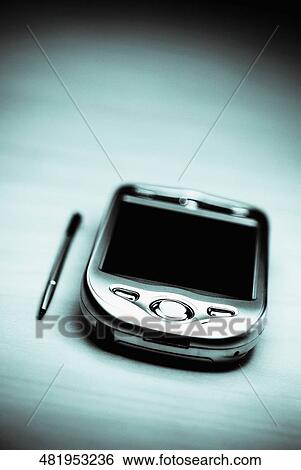 Stock Photograph - Close-up of a personal data assistant with a stylus. Fotosearch