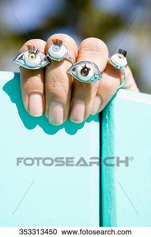Close-up of a person's finger with rings View Large Photo Image Stock Image - Close-up of a person's finger with rings. Fotosearch