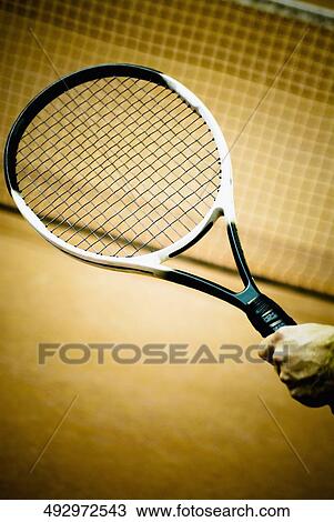 Close-up of a person's hand holding a tennis racket View Large Photo Image Stock Image - Close-up of a person's hand holding a tennis racket. Fotosearch