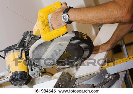 Close-up of a person's hand using a circular saw View Large Photo Image Stock Photography - Close-up of a person's hand using a circular saw. Fotosearch