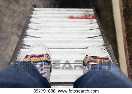 Close-up of a person's legs on a ladder View Large Photo Image Stock Photo - Close-up of a person's legs on a ladder. Fotosearch
