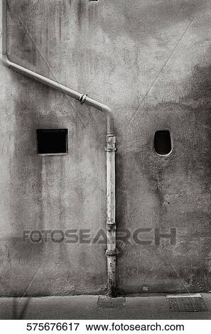 Stock Photo - Close-up of a pipe mounted on a wall. Fotosearch