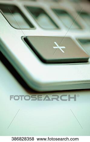 Close-up of a plus sign on the keypad of a calculator View Large Photo Image Stock Photo - Close-up of a plus sign on the keypad of a calculator. Fotosearch