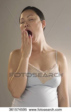 Close-up of a pregnant woman yawning View Large Photo Image Stock Photography - Close-up of a pregnant woman yawning. Fotosearch