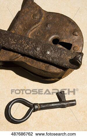 Close-up of a rusty lock with a key View Large Photo Image Stock Image - Close-up of a rusty lock with a key. Fotosearch