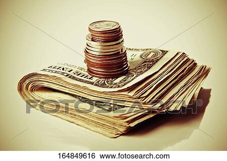 Close-up of a stack of coins on stack of US dollar bills View Large Photo Image Stock Photograph - Close-up of a stack of coins on stack of US dollar bills. Fotosearch