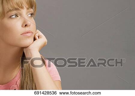 Close-up of a student day dreaming View Large Photo Image Stock Photograph - Close-up of a student day dreaming. Fotosearch